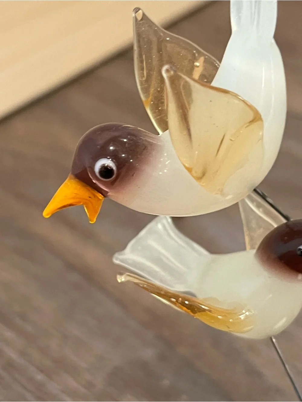 Blown glass bird with nest sculpture